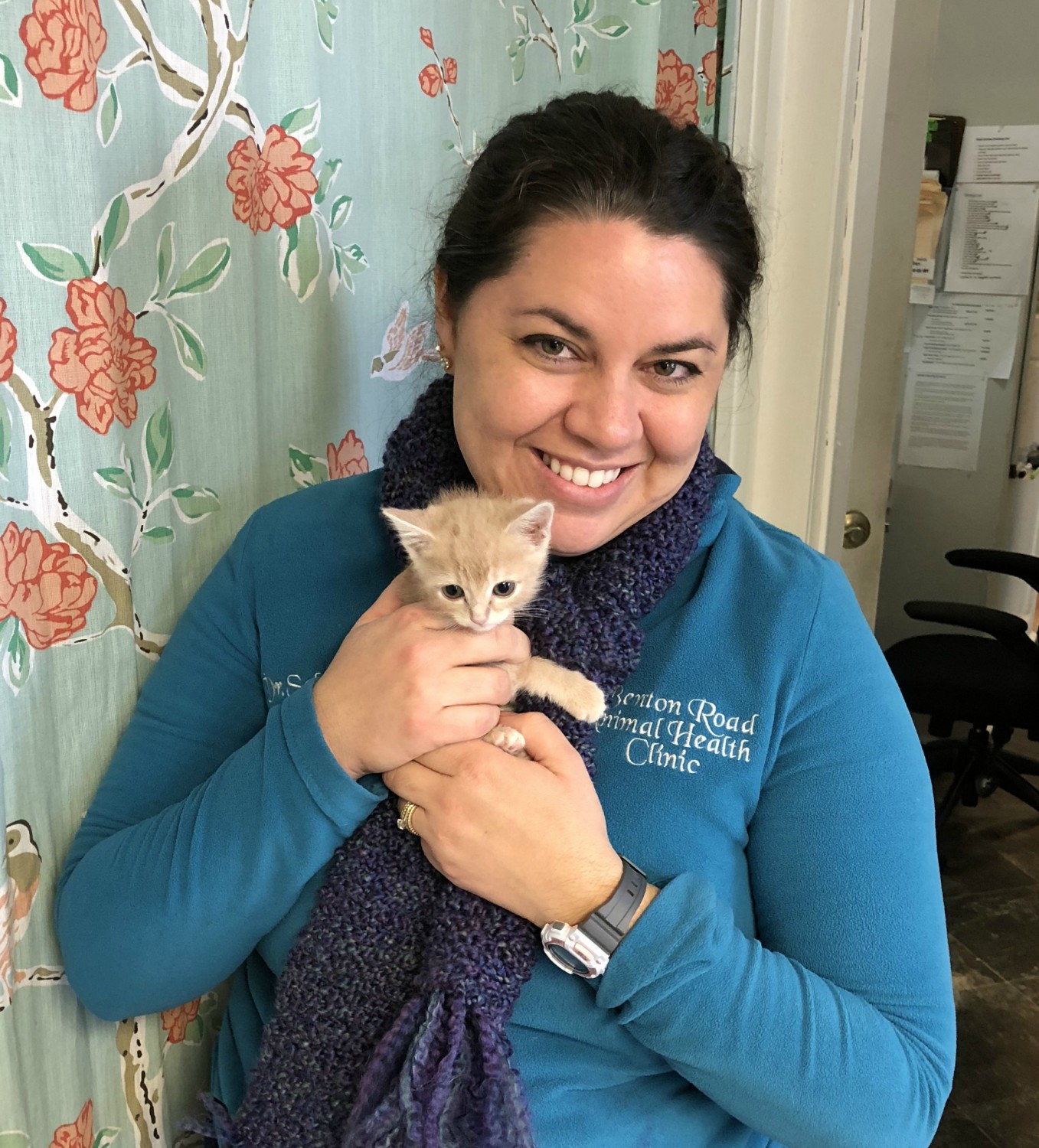  Dr. Sabina Squires DVM, CVA holding yellow kitten