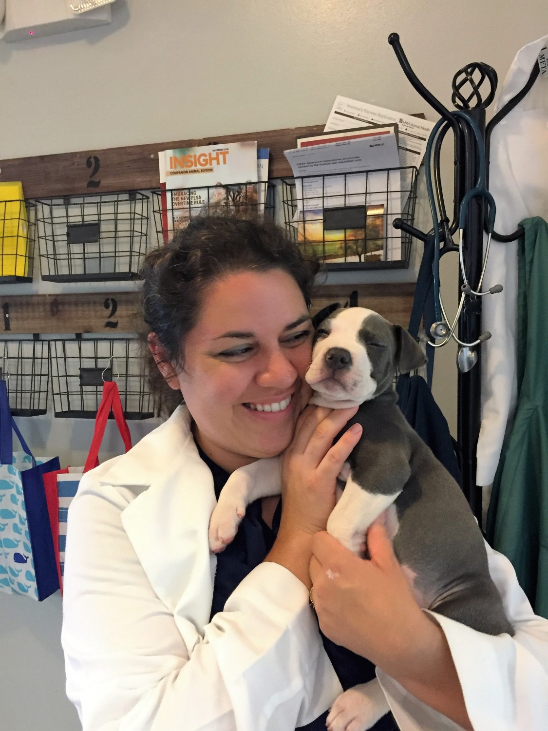 Dr. Sabina Squires DVM, CVA holding puppy